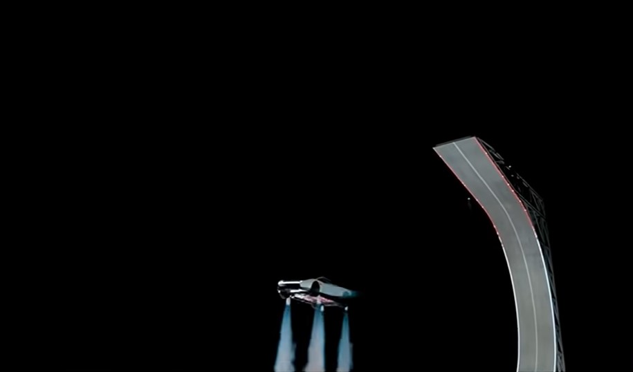 Cold-gas thrusters fire as the Roadster flips mid-air