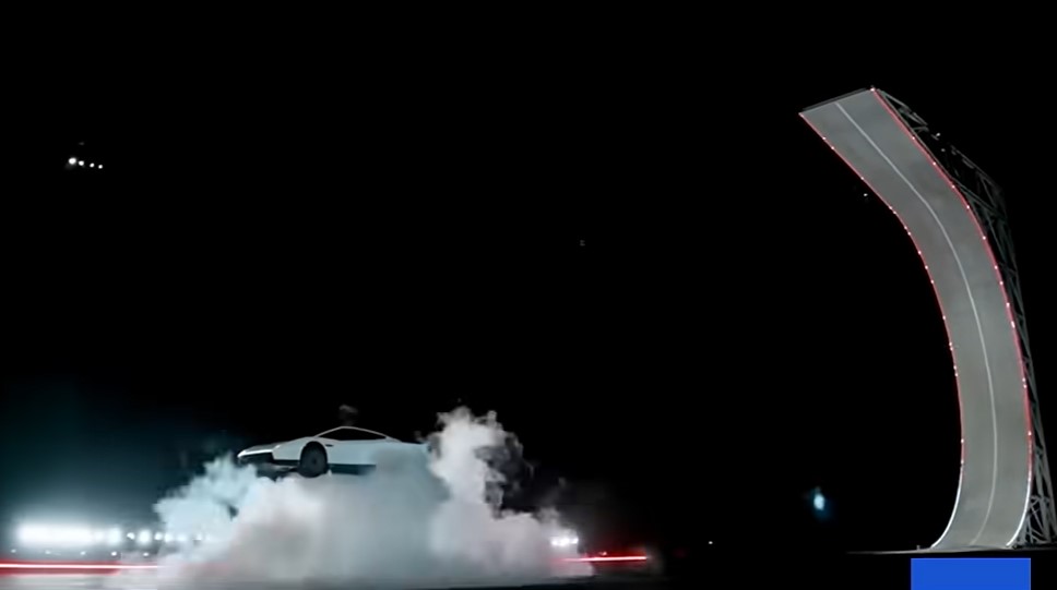 The Roadster lands in a cloud of white smoke