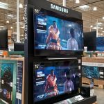 Large-screen Samsung and Sony televisions on display at a Costco warehouse store