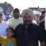 An Indian family waves the flag of India at the Upper Darby International Festival in Upper Darby, Pennsylvania.