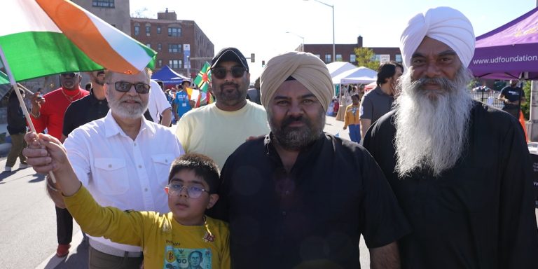 An Indian family waves the flag of India at the Upper Darby International Festival in Upper Darby, Pennsylvania.