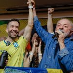 President Luiz Inácio Lula da Silva speaks into a microphone surrounded by supporters after his reelection victory in São Paulo, Brazil, on Oct. 25, 2026.
