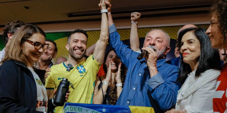President Luiz Inácio Lula da Silva speaks into a microphone surrounded by supporters after his reelection victory in São Paulo, Brazil, on Oct. 25, 2026.