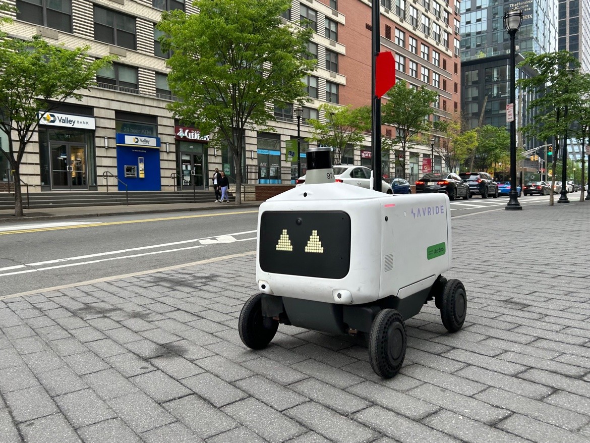 An Avride delivery robot on a sidewalk in Jersey City, New Jersey.