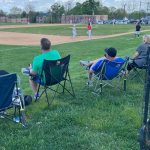 Spectators watch a Marple Newtown High School baseball home game