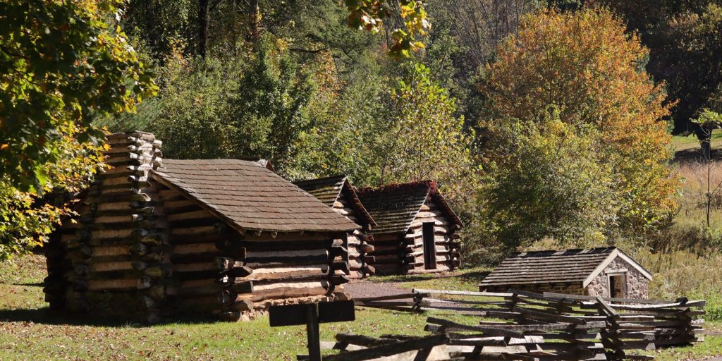 Reconstructed Continental Army log huts at Valley Forge National Historical Park in fall